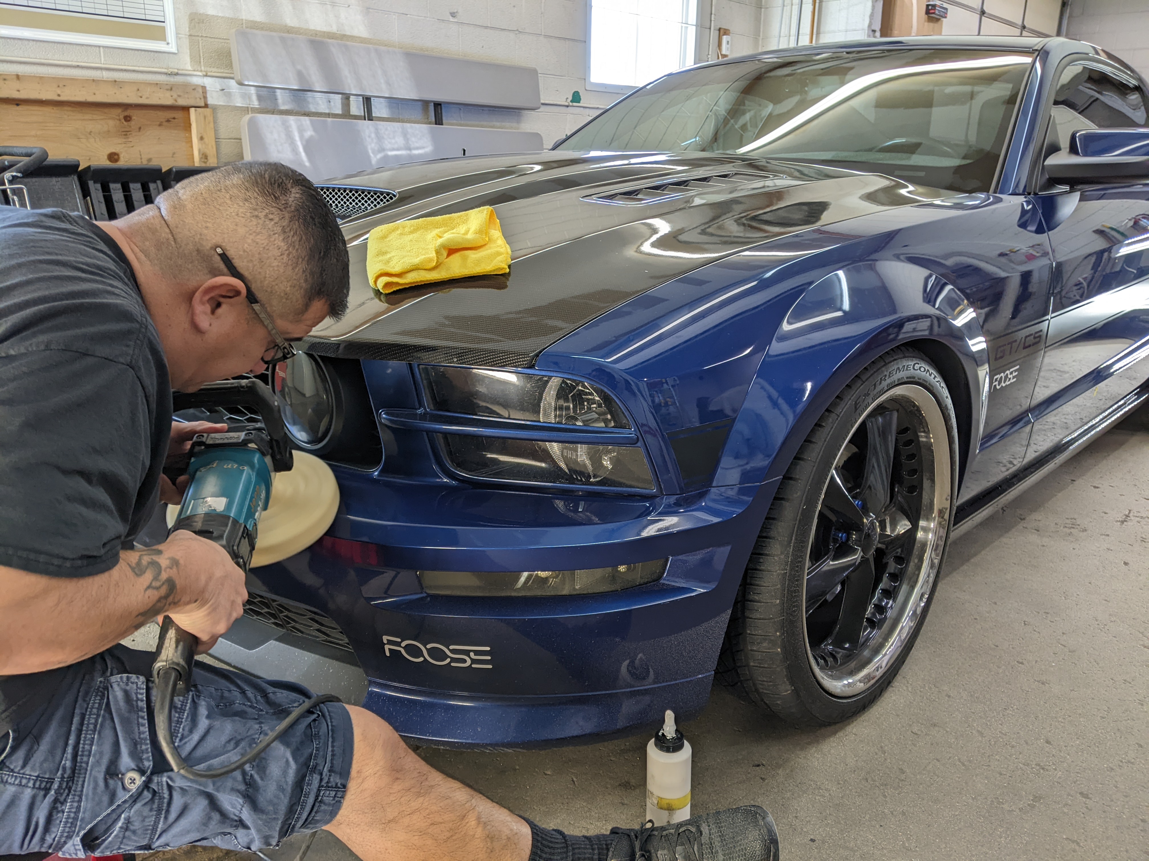 First step of the 2-step paint correction begins. Notice the lack of clear bra on the hood and fenders. The clear bra was removed prior to starting the 2-step paint correction process. This was followed by the second and final step of the 2-step paint correction.