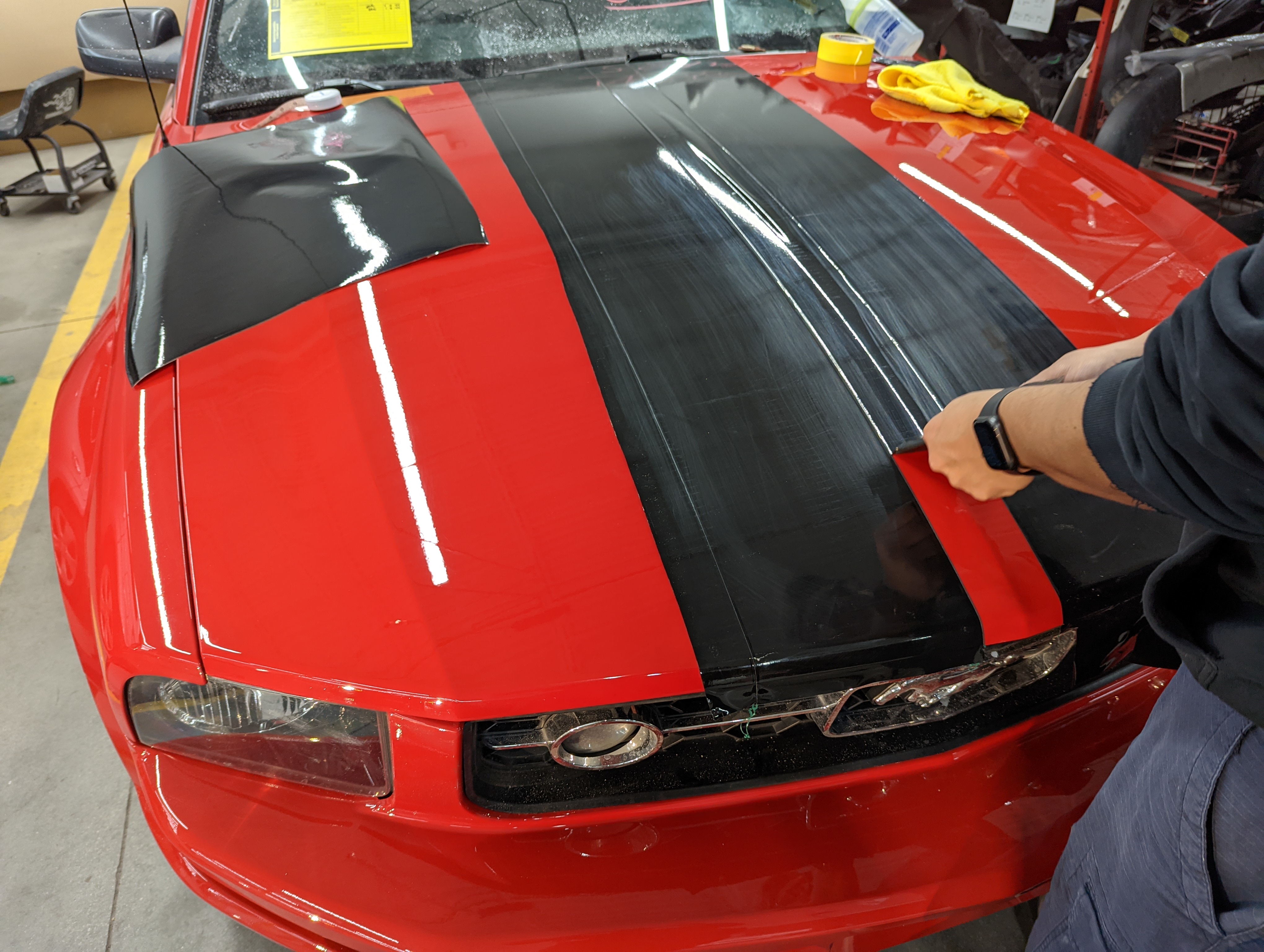 2006 Ford Mustang Vinyl Stripes. Removing the excess vinyl after cutting with knife-less tape.