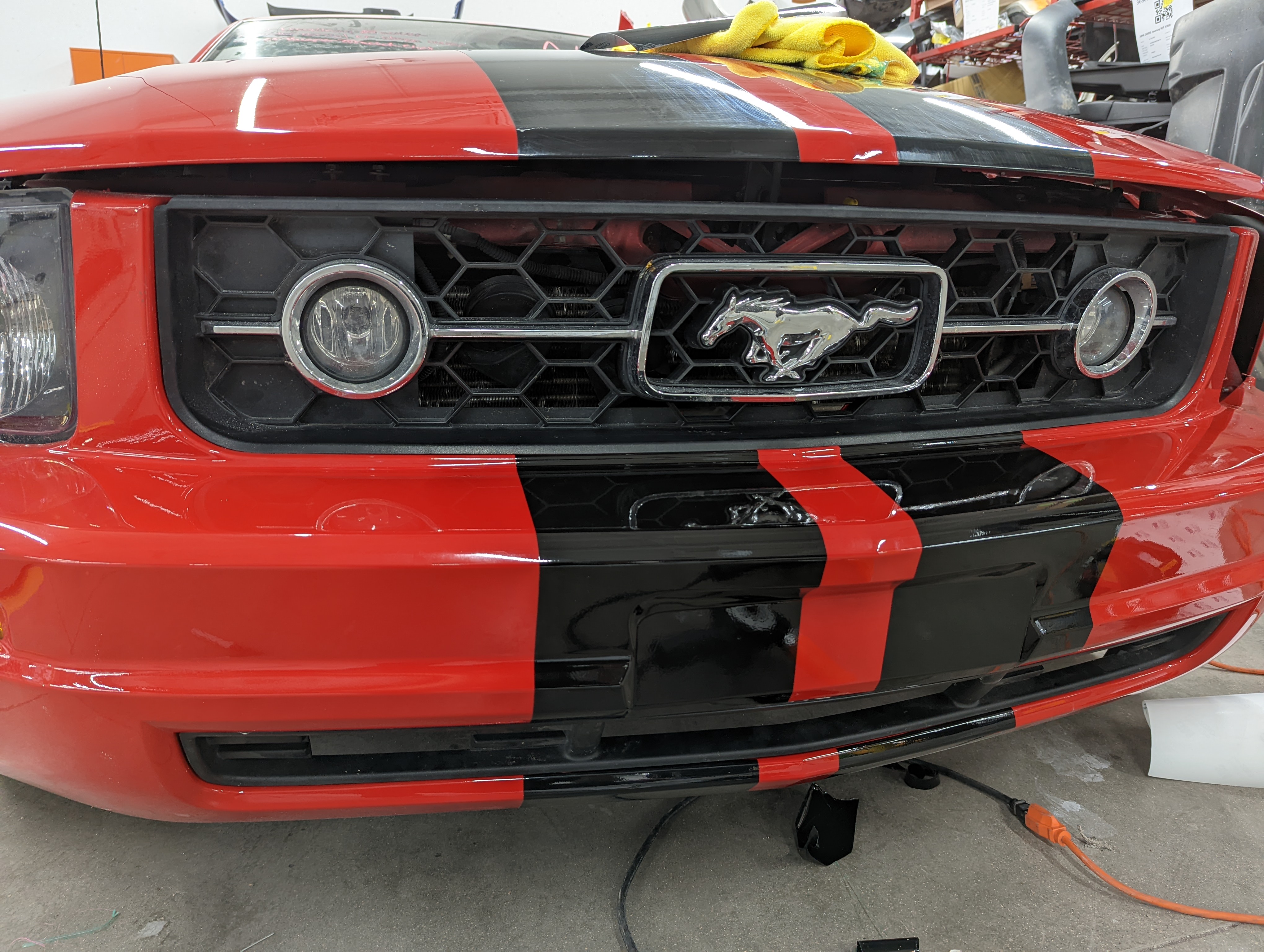 2006 Ford Mustang Vinyl Stripes. Front bumper finished after knife-less tape and excess removed.