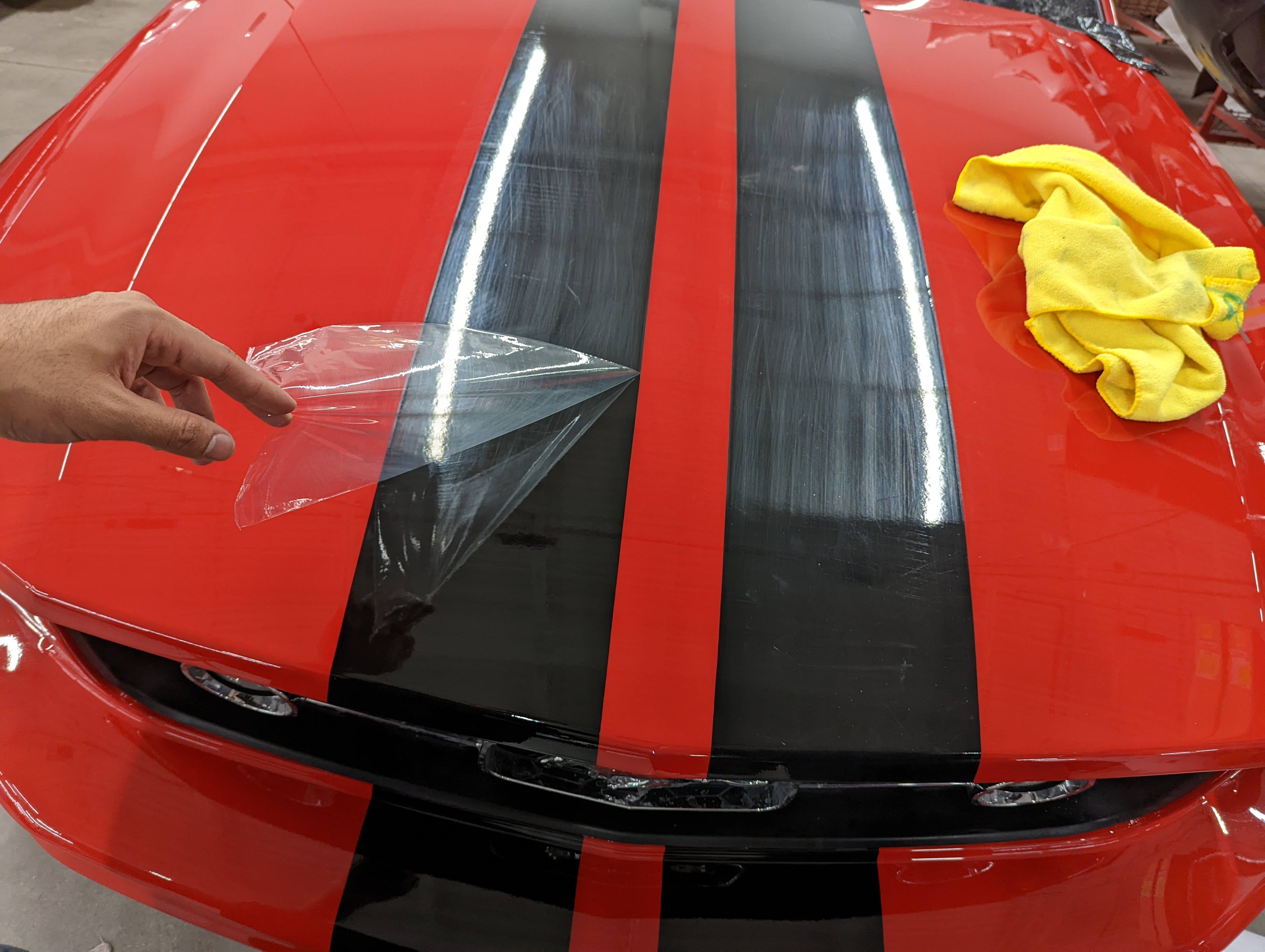 2006 Ford Mustang Vinyl Stripes. Removing the anti-scratch cap sheet after installation. Notice the lack of scratches from installation because of protective cap sheet.