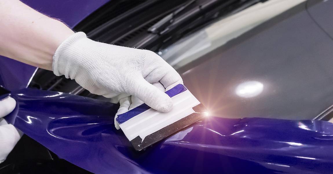 Applying a ceramic coating to a vehicle with paint protection film (PPF) 