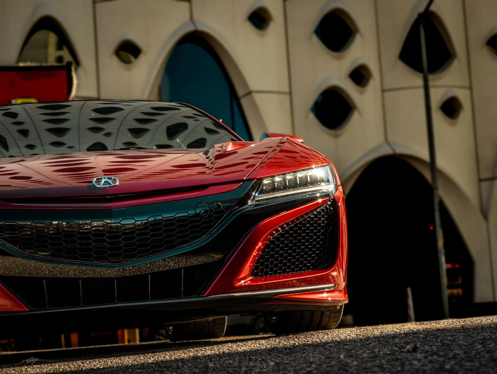 Valencia Red Pearl 2021 Acura NSX photographed in front of building in Denver Colorado