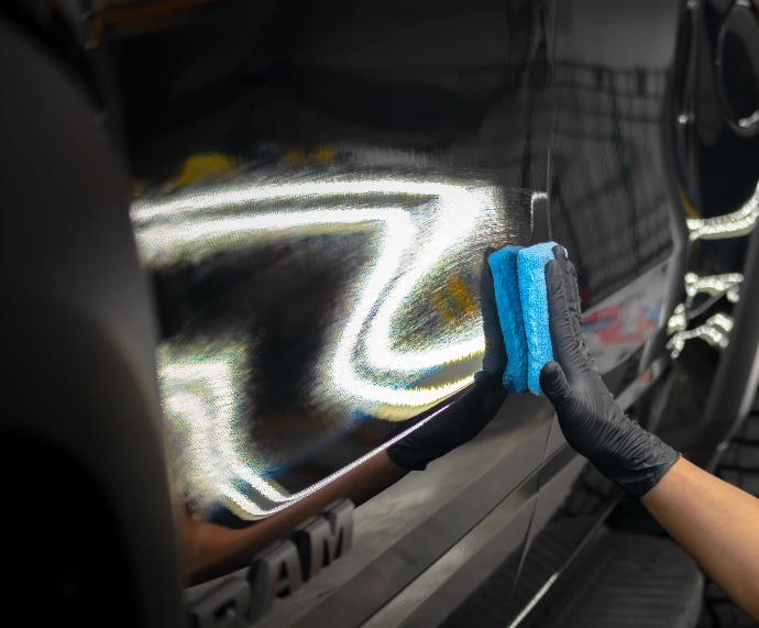 Ceramic coating being applied to truck paint for gloss and protection