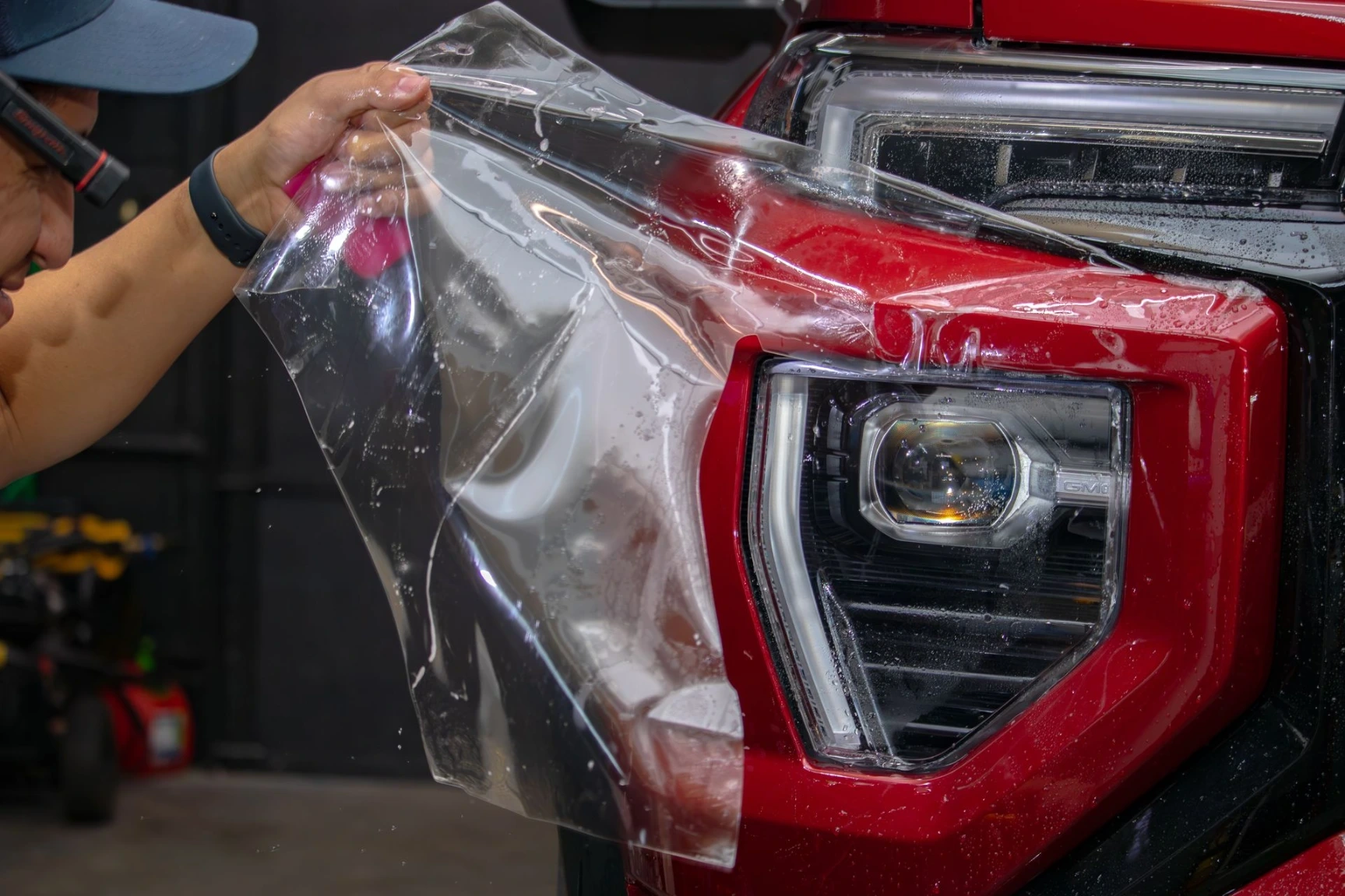 Professional installing clear bra 