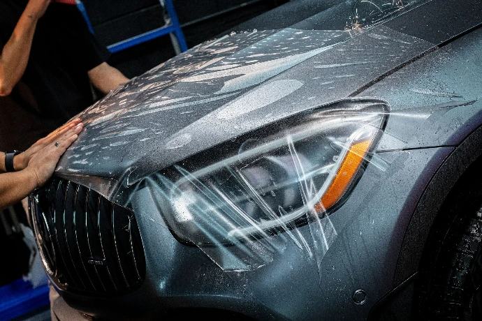 Installation of matte finish PPF on a vehicle hood at Pro-Tech Auto Shield in Wheat Ridge