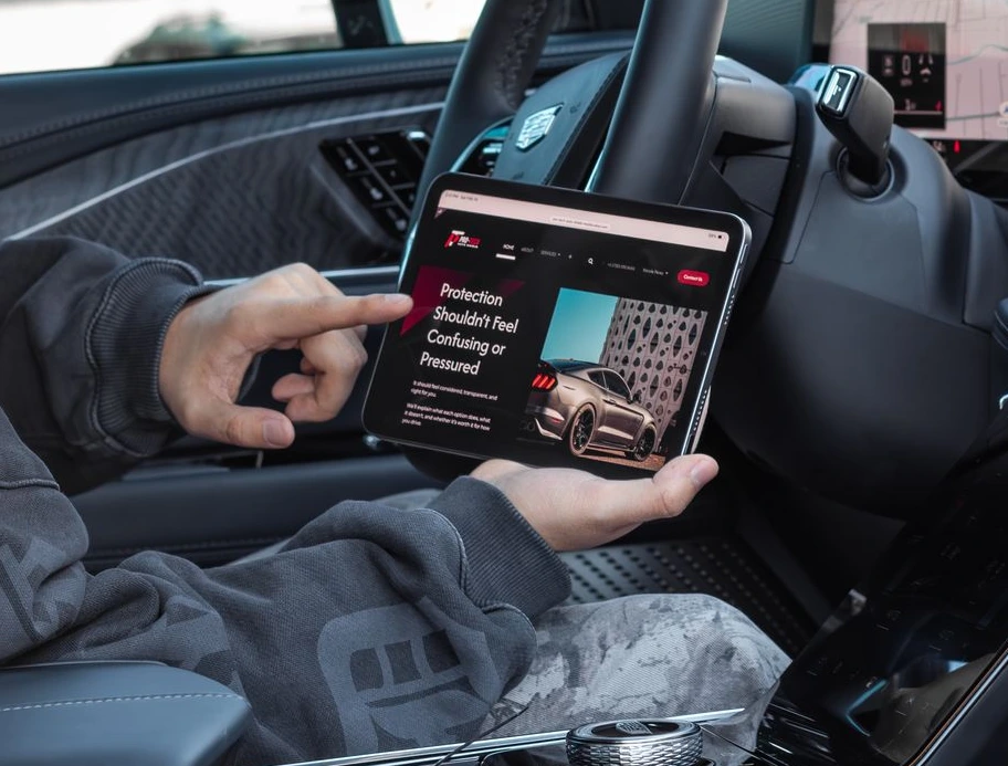 Person browsing Pro-Tech Auto Shield Home page