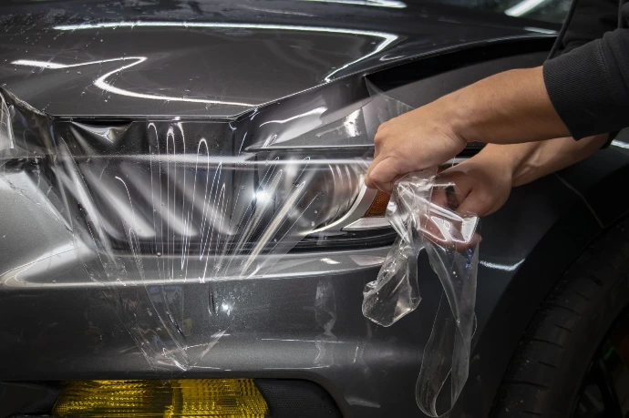 Installation and stretching of clear bra PPF on a 2018 Ford Shelby GT350 hood at Pro-Tech Auto Shield in Wheat Ridge