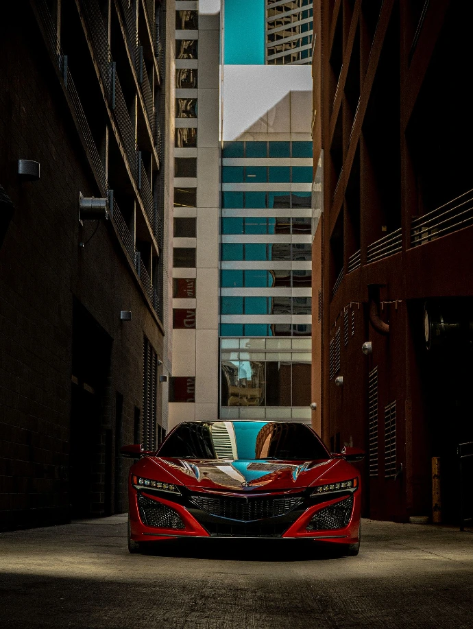 Valencia Pearl Red 2021 Acura NSX parked in between Denver alley