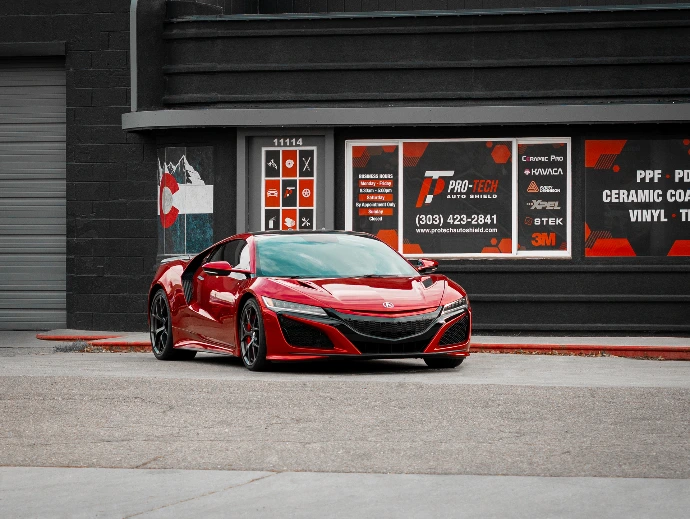 Valencia Red Pearl 2021 Acura NSX in front of Pro-Tech Auto Shield building