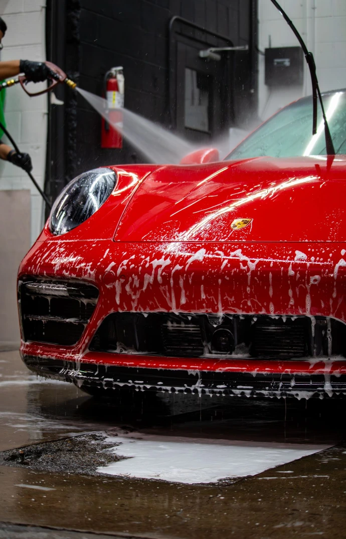 2024 Porsche 911 Carrera GTS showing ceramic coating water beading during a maintenance wash at Pro-Tech Auto Shield