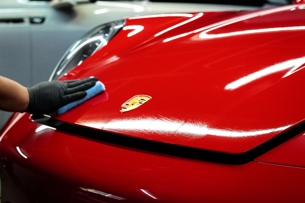Applying Fusion Plus Ceramic Coating Premium V2 to 2024 Porsche 911 Carrera GTS hood at Pro-Tech Auto Shield in Wheat Ridge