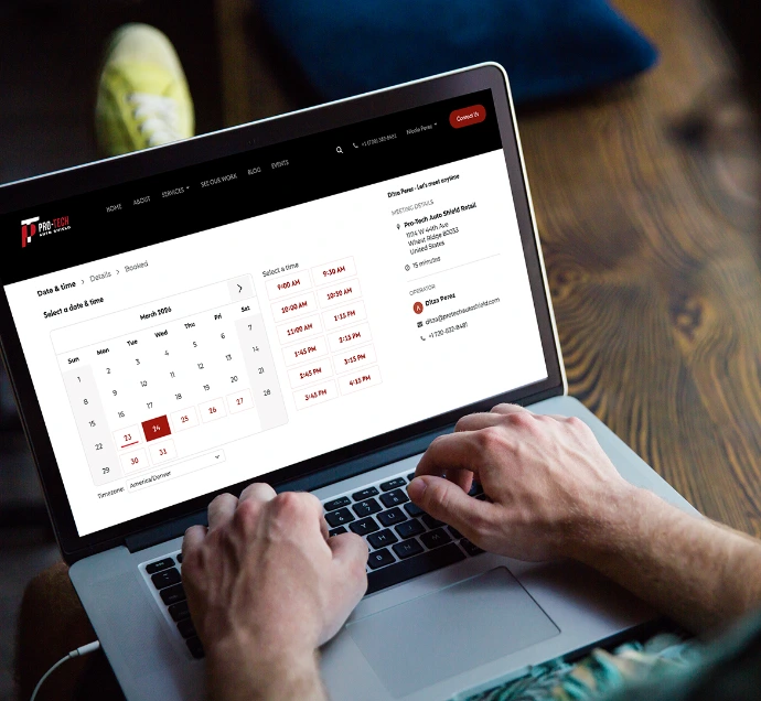 Person browsing Pro-Tech Auto Shield Calendar page