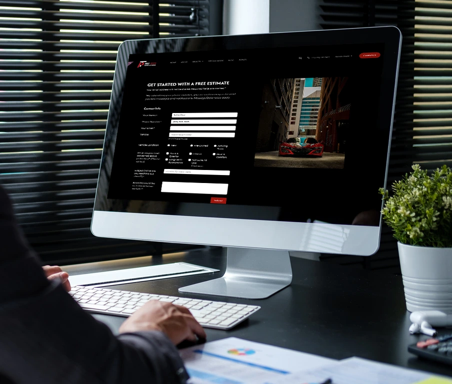 Person browsing Pro-Tech Auto Shield Contact Us page on iMac