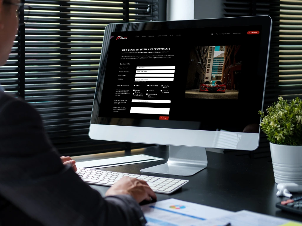 Person browsing Pro-Tech Auto Shield Contact Us page on iMac