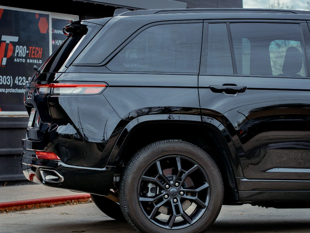 High-performance window tint installation on the back window of a Jeep Cherokee at Pro-Tech Auto Shield in Wheat Ridge