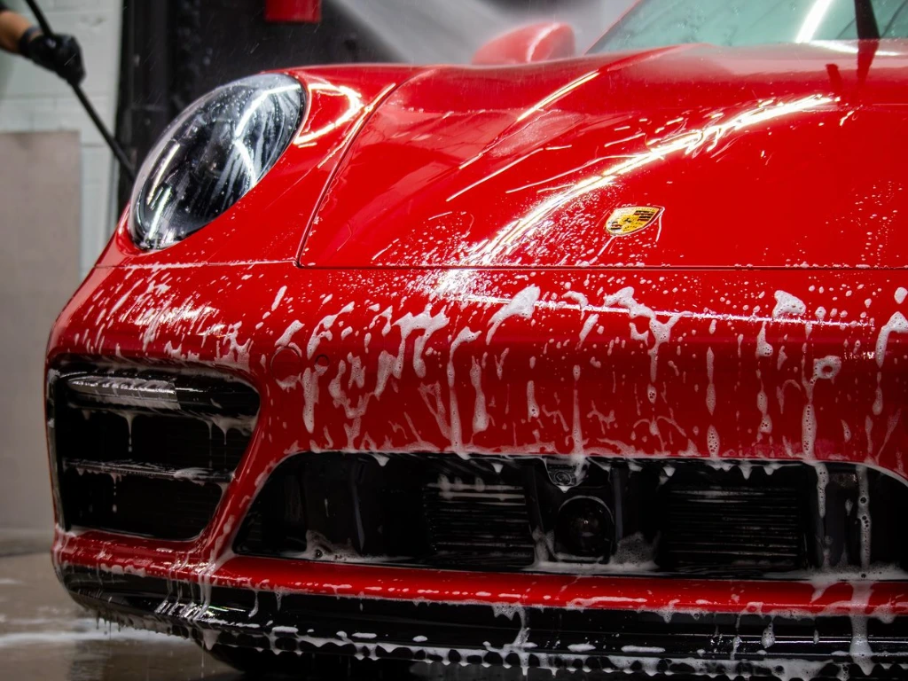 2024 Porsche 911 Carrera GTS showing ceramic coating water beading during a maintenance wash at Pro-Tech Auto Shield