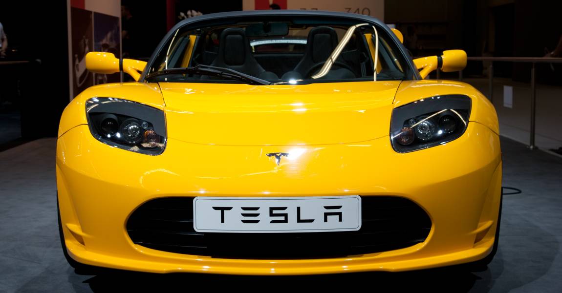 yellow tesla roadster