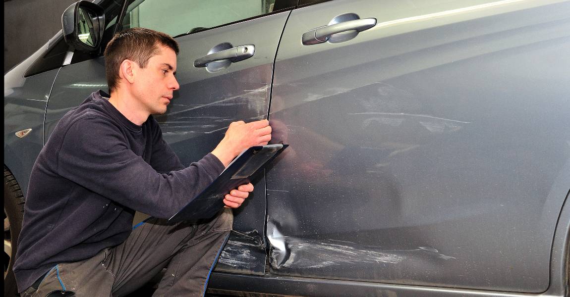silver car body damage